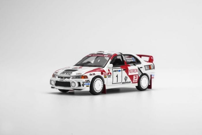 MOTORHELIX Mitsubishi Lancer Evolution IV GSR 1997 Finland Rally Winner Diecast Model Car 1:64
